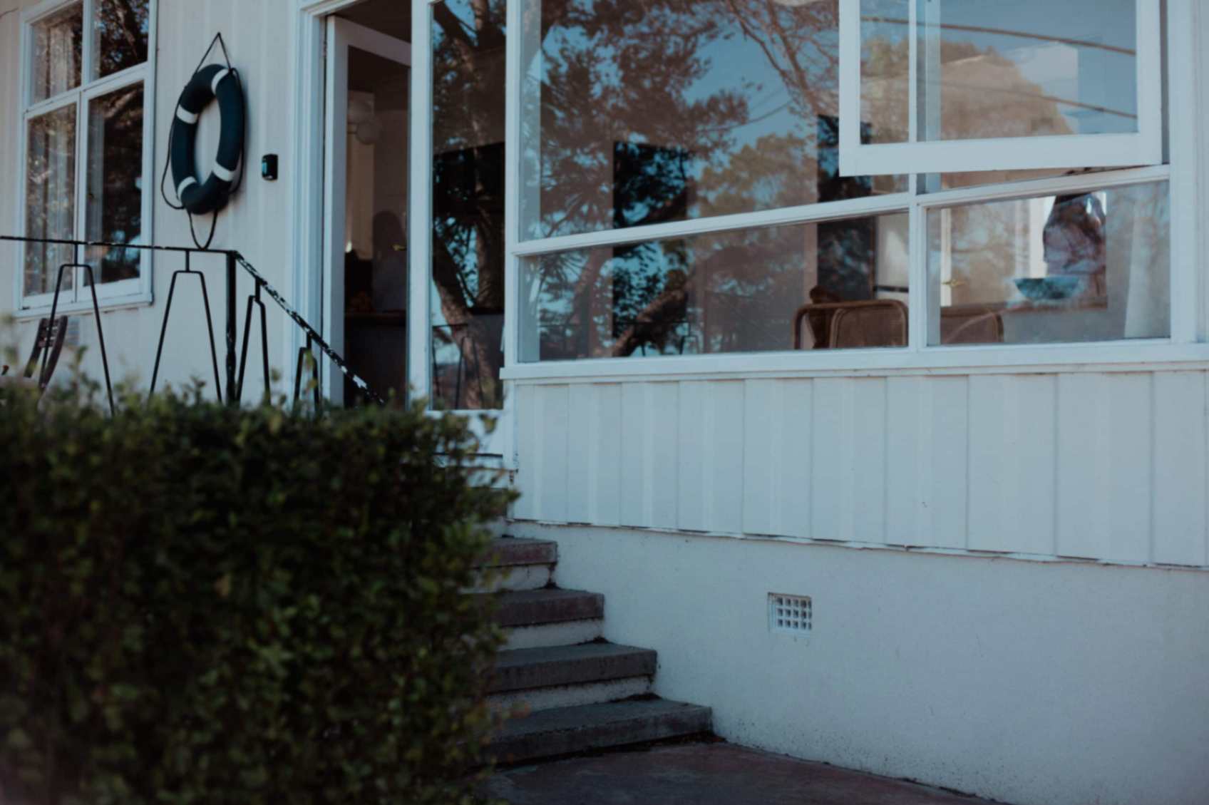 Front door area of Doma Short Point with stairs and windows
